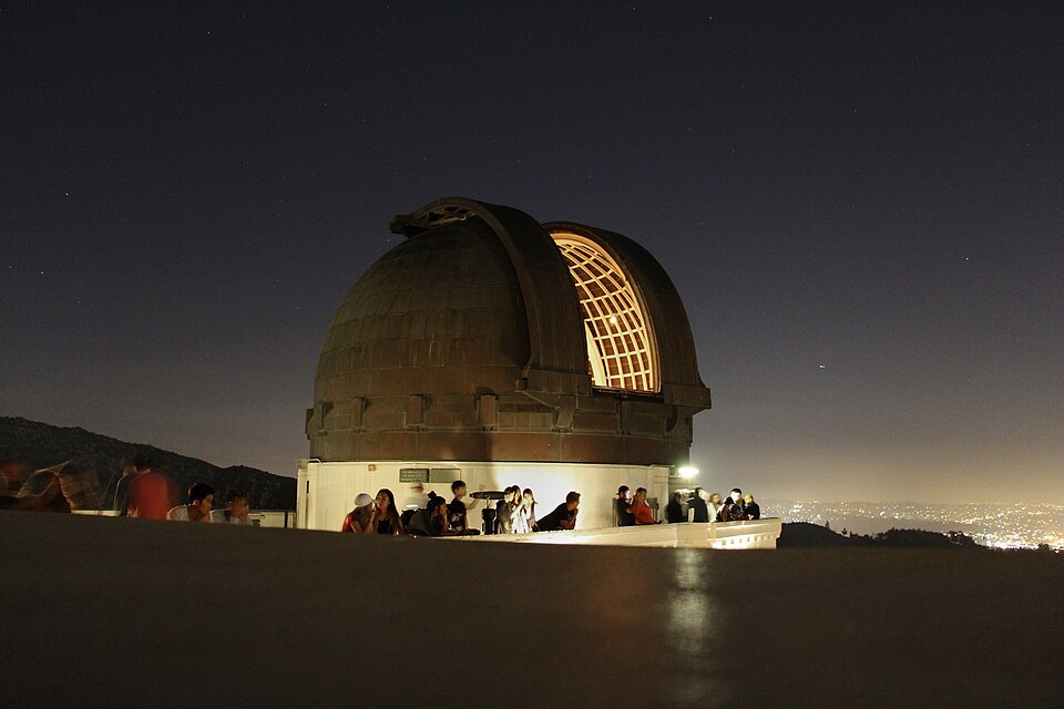 Illuminated telescope dome at Griffith Observatory at night