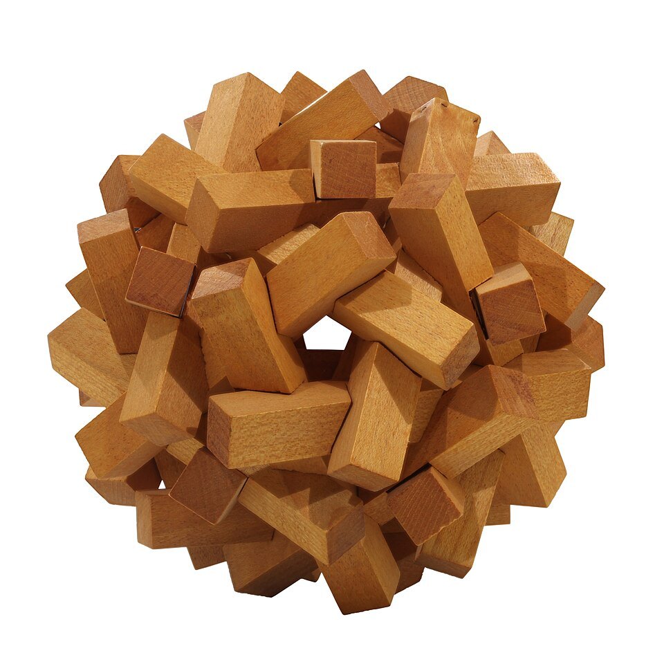 Interlocking wooden puzzle pieces on a white background