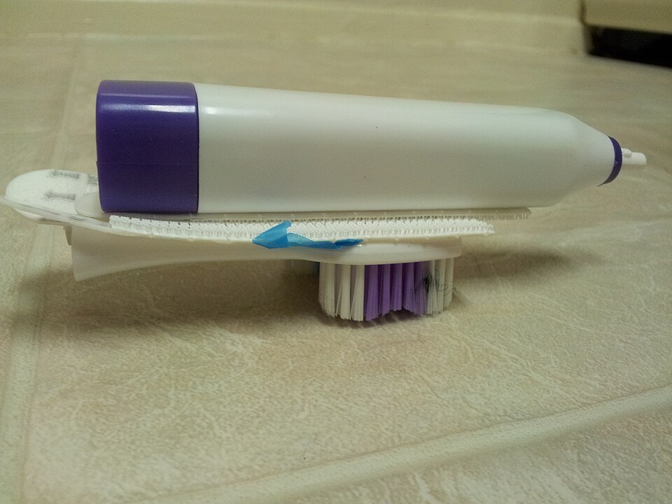 A homemade bristlebot with a toothbrush head and electric handle