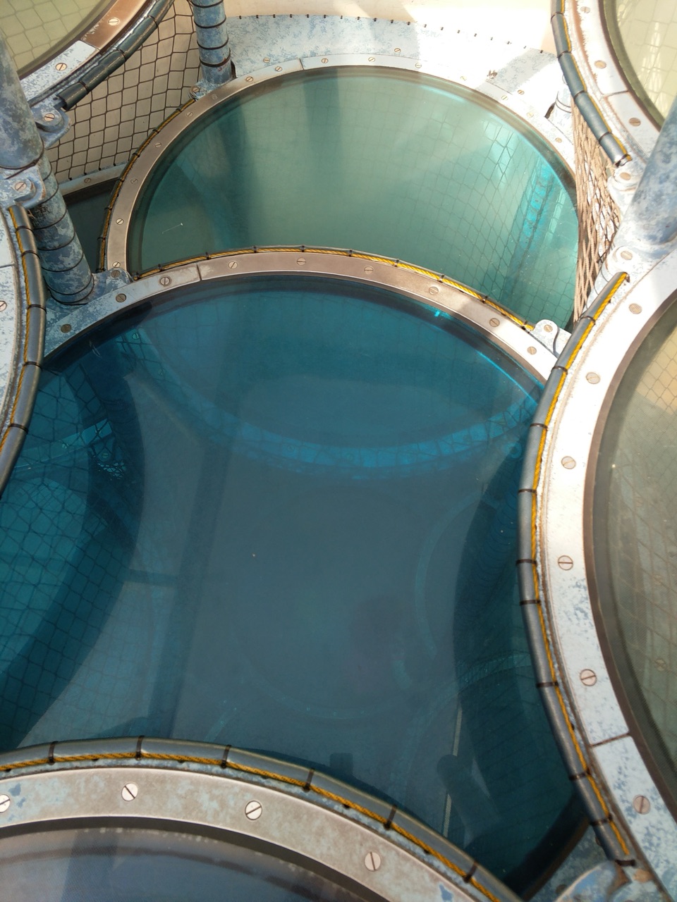 Curved blue panels and climbing structure at Kidspace Children’s Museum